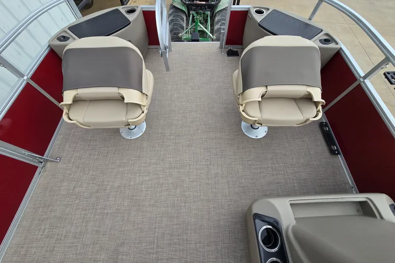 Slide: The Image of 2025 Sun Tracker Bass Buggy 18 DLX interior with two beige seats and red accents. - 7
