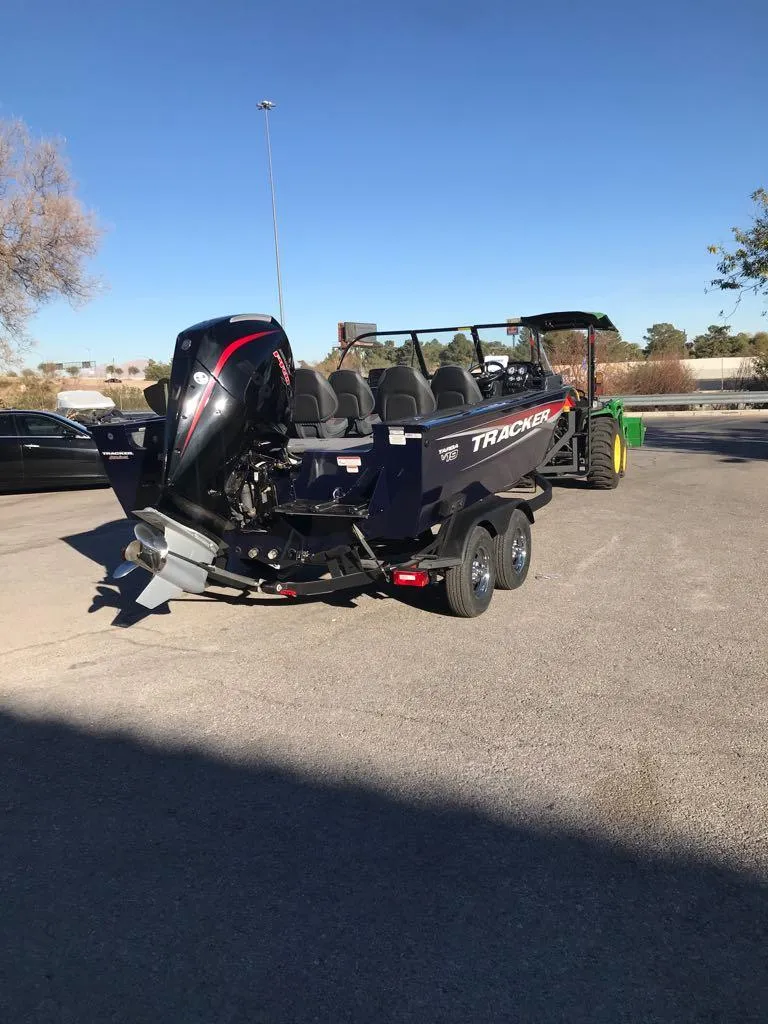 Slide: The Image of 2025 Tracker Targa V-19 Combo boat on trailer, parked outdoors. - 10
