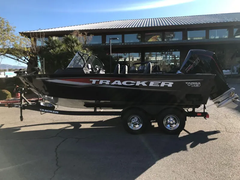 Slide: The Image of 2025 Tracker Targa V-19 Combo boat on trailer, parked outdoors. - 2