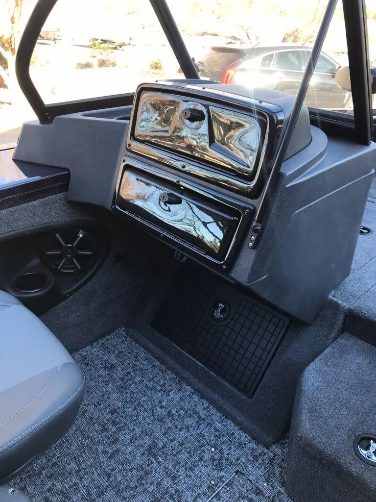 Slide: The Image of 2025 Tracker Targa V-19 Combo boat interior with dashboard and seating. - 22
