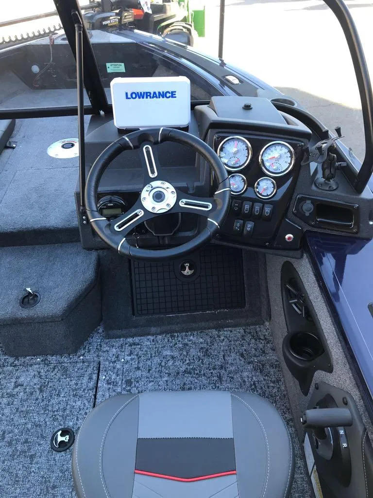 Slide: The Image of 2025 Tracker Targa V-19 Combo boat dashboard with Lowrance system and gauges. - 26