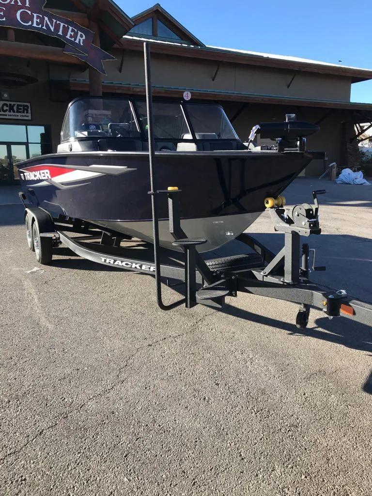 Slide: The Image of 2025 Tracker Targa V-19 Combo boat on trailer, parked outdoors. - 3