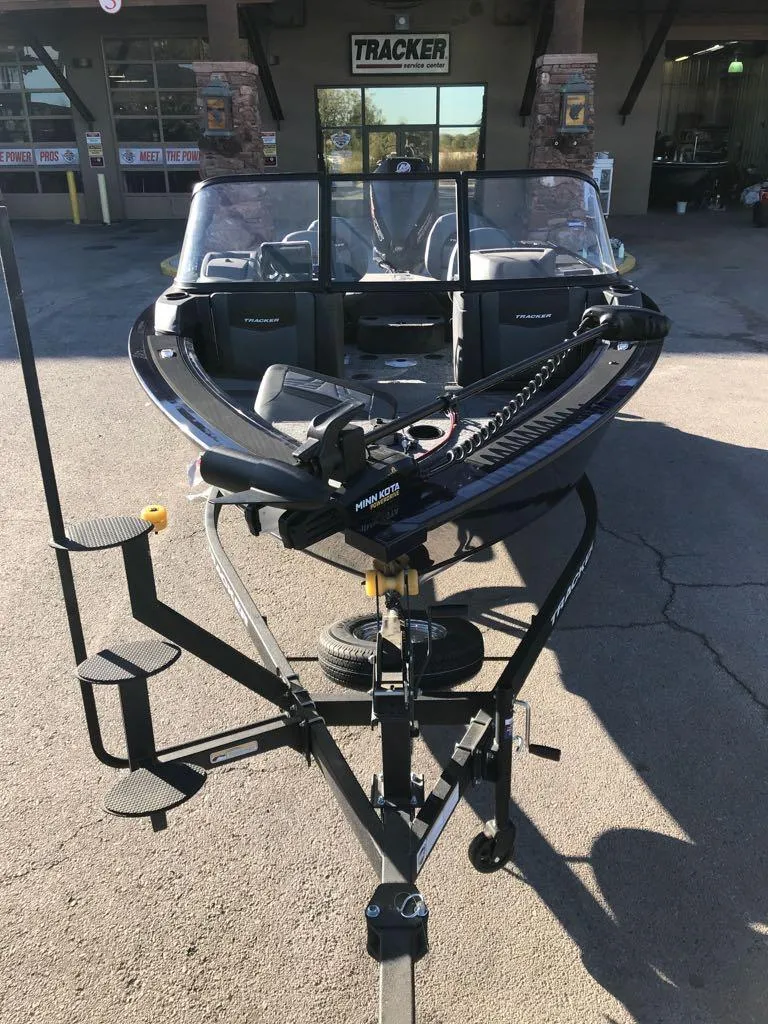 Slide: The Image of 2025 Tracker Targa V-19 Combo boat on trailer, parked outdoors. - 4