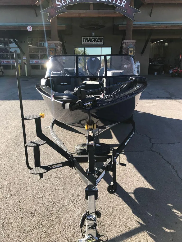 Slide: The Image of 2025 Tracker Targa V-19 Combo boat on trailer at service center. - 5