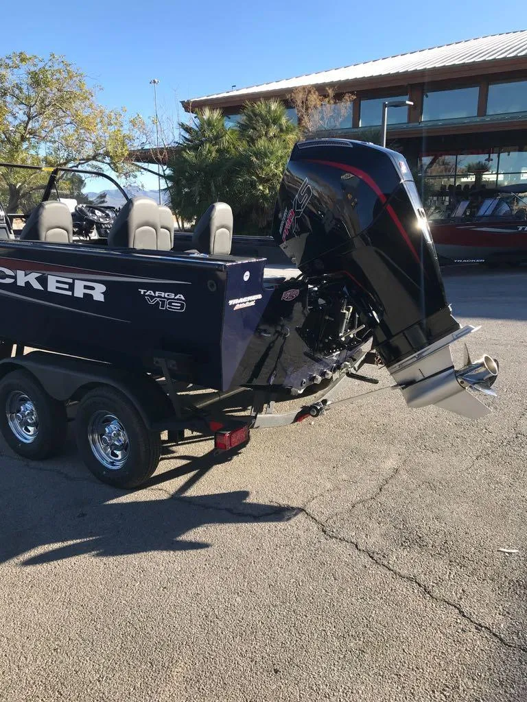 Slide: The Image of 2025 Tracker Targa V-19 Combo boat with powerful outboard motor on trailer. - 8