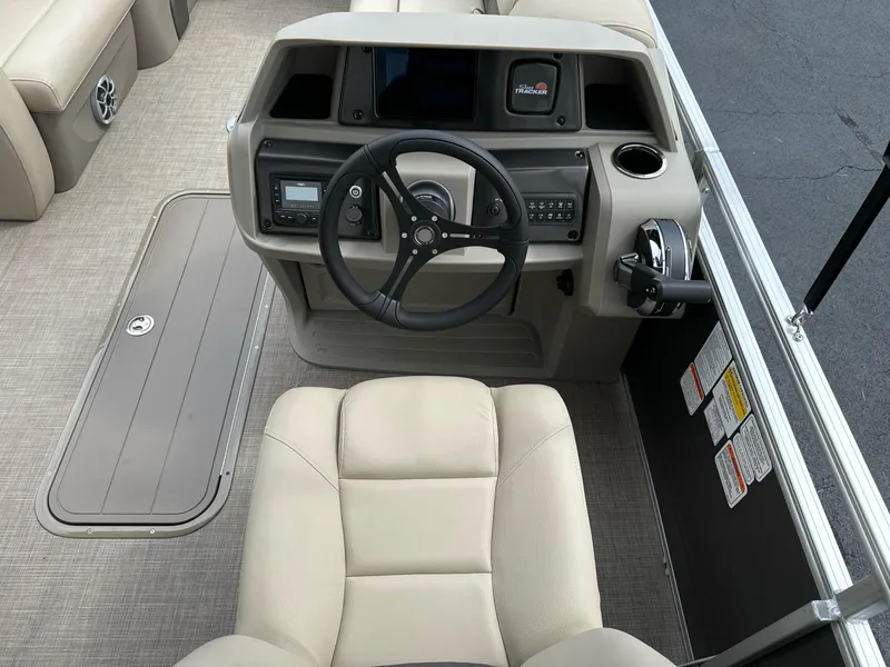 Slide: The Image of 2025 Sun Tracker Party Barge 22 RF XP3 helm with steering wheel and controls. - 13