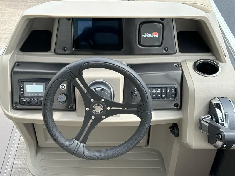 Slide: The Image of 2025 Sun Tracker Party Barge 22 RF XP3 steering console with modern controls and dashboard. - 14