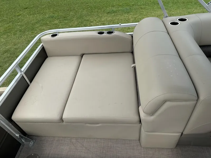 Slide: The Image of 2025 Sun Tracker Party Barge 22 RF XP3 seating with cup holders on a pontoon boat. - 17