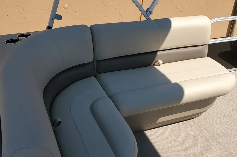 Slide: The Image of 2025 Sun Tracker Party Barge 16 DLX interior seating with cup holders. - 49