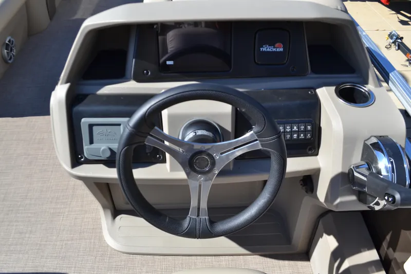 Slide: The Image of 2025 Sun Tracker SportFish 22 DLX steering console with modern controls and dashboard. - 3