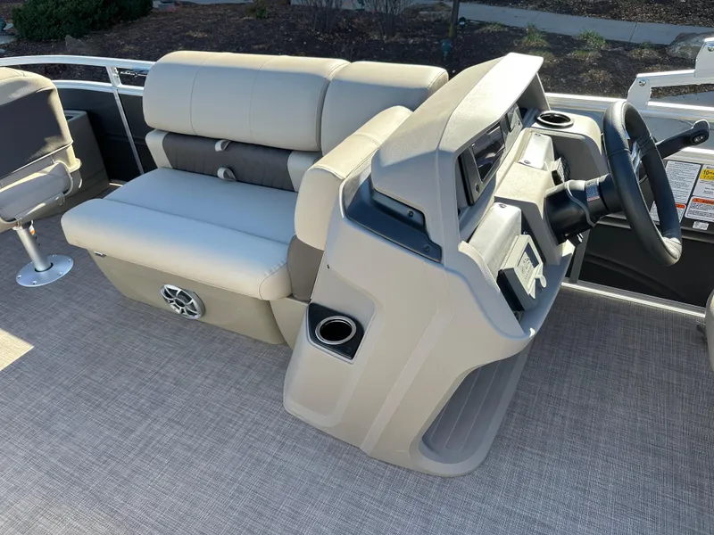 Slide: The Image of 2025 Sun Tracker Fishin' Barge 20 DLX interior with helm and seating area. - 5