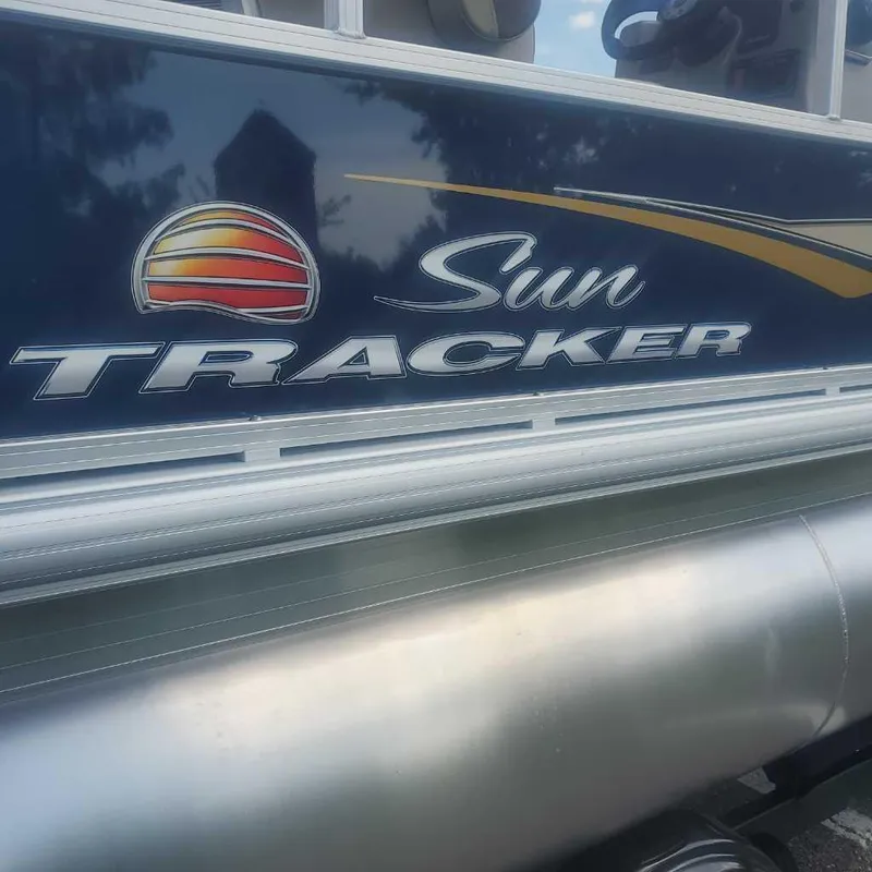 Slide: The Image of 2025 Sun Tracker Bass Buggy 16 XL Select logo on boat exterior. - 2