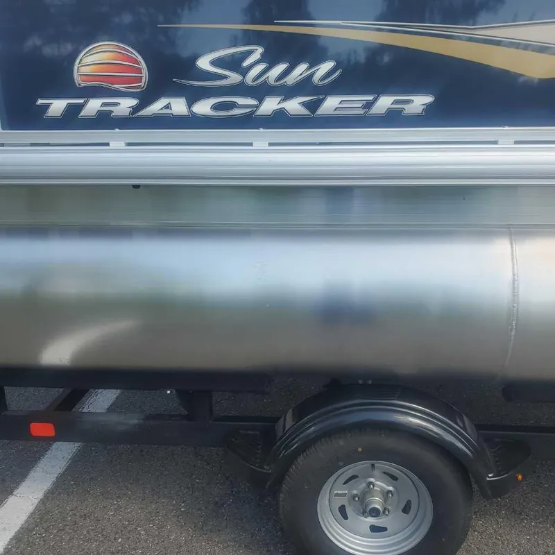 Slide: The Image of 2025 Sun Tracker Bass Buggy 16 XL Select pontoon boat on trailer. - 3