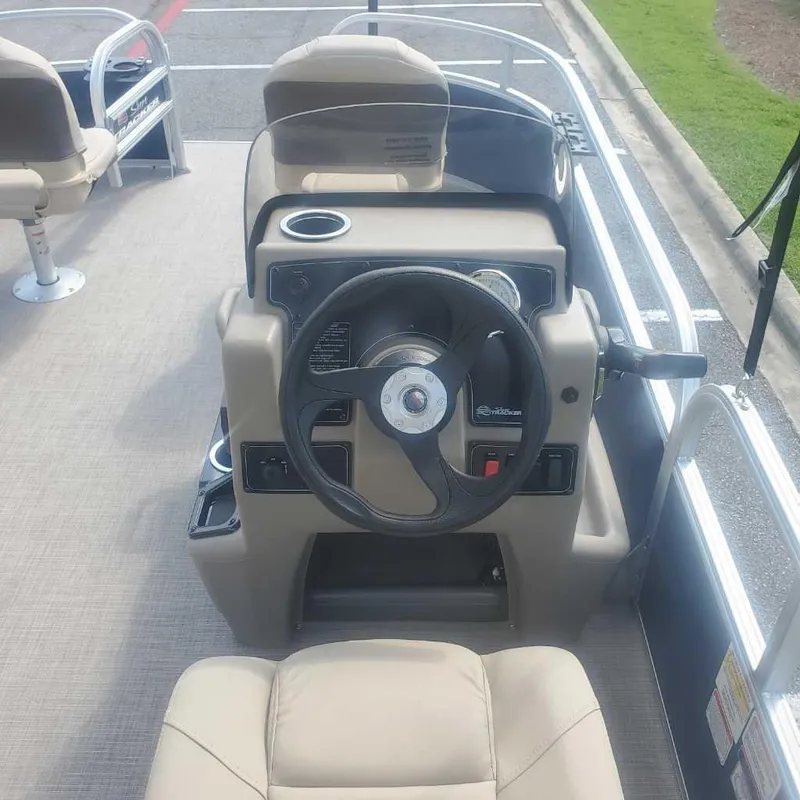 Slide: The Image of 2025 Sun Tracker Bass Buggy 16 XL Select boat interior with steering console. - 8