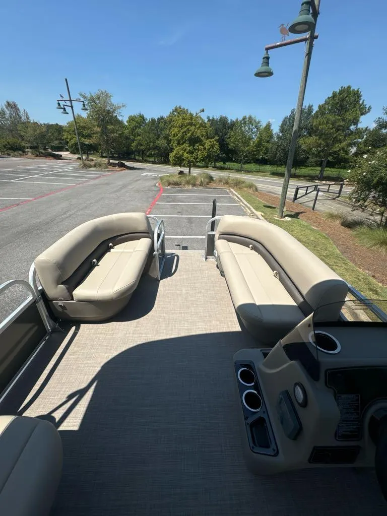 Slide: The Image of 2025 Sun Tracker Party Barge 16 DLX pontoon boat with spacious seating and modern design. - 7