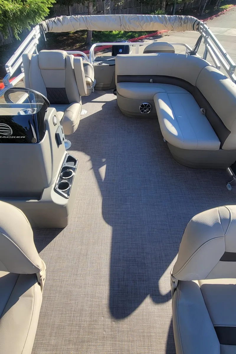 Slide: The Image of 2025 Sun Tracker Bass Buggy 18 DLX pontoon boat interior with spacious seating and modern design. - 3