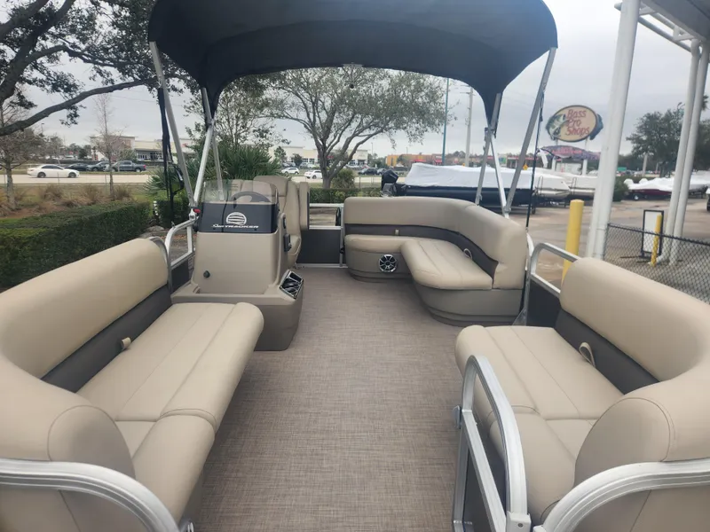 Slide: The Image of 2025 Sun Tracker Party Barge 16 DLX pontoon boat with spacious seating and canopy. - 4