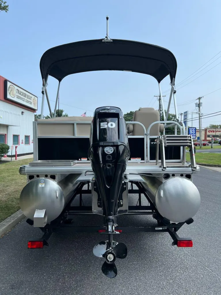 Slide: The Image of 2025 Sun Tracker Party Barge 16 DLX pontoon boat with 50 HP engine, rear view. - 3