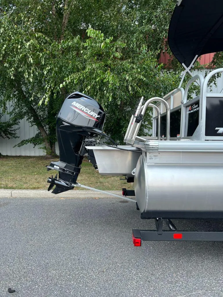 Slide: The Image of 2025 Sun Tracker Party Barge 16 DLX pontoon boat with Mercury outboard motor. - 4