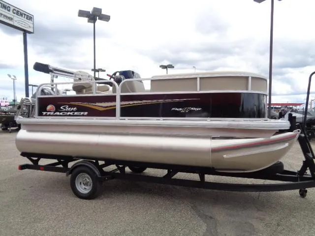 Slide: The Image of 2025 Sun Tracker Party Barge 16 DLX pontoon boat on trailer. - 44