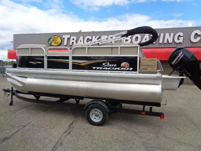 Slide: The Image of 2025 Sun Tracker Party Barge 16 DLX pontoon boat on trailer at dealership. - 46