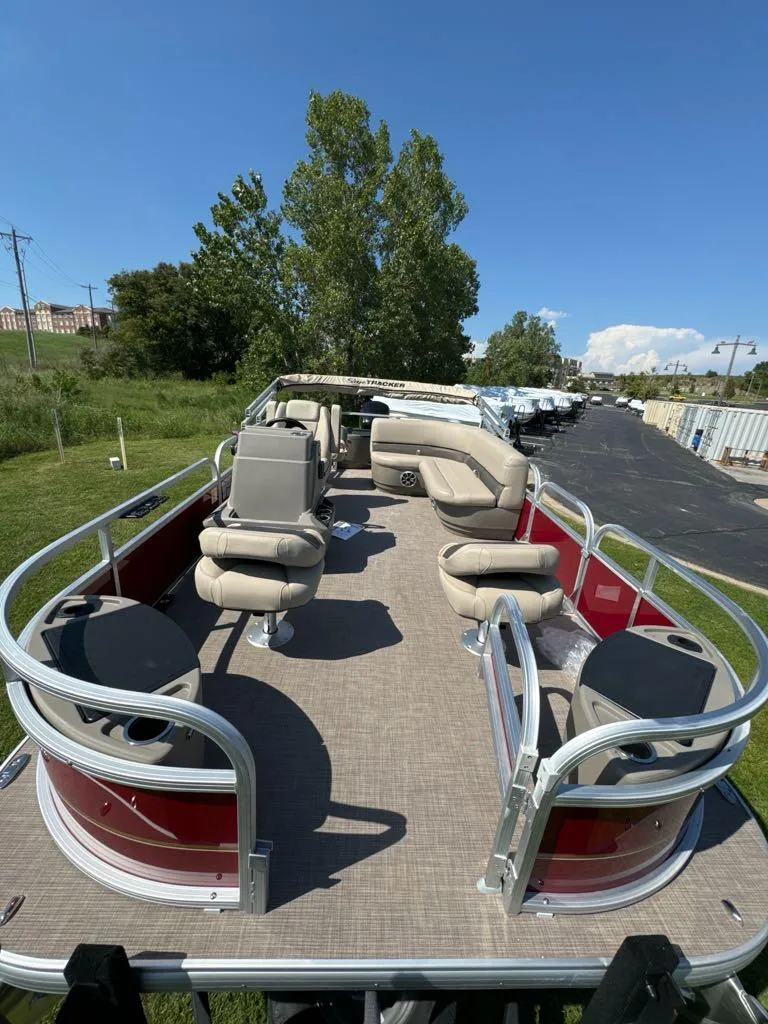 Slide: The Image of 2025 Sun Tracker Bass Buggy 18 DLX pontoon boat with spacious seating and open deck. - 2