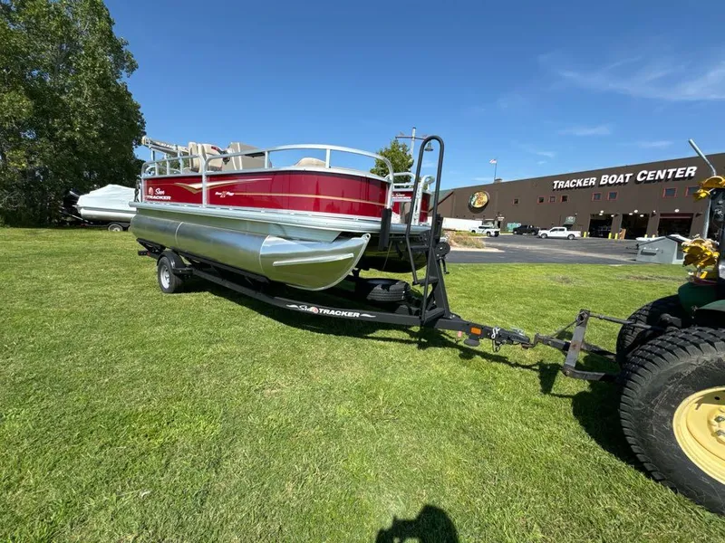 Slide: The Image of 2025 Sun Tracker Bass Buggy 18 DLX pontoon boat on trailer at Tracker Boat Center. - 8