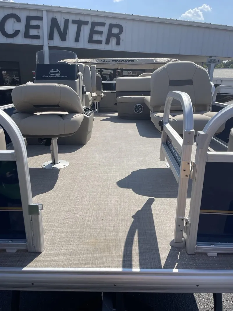 Slide: The Image of 2025 Sun Tracker Bass Buggy 18 DLX pontoon boat interior with seating. - 4