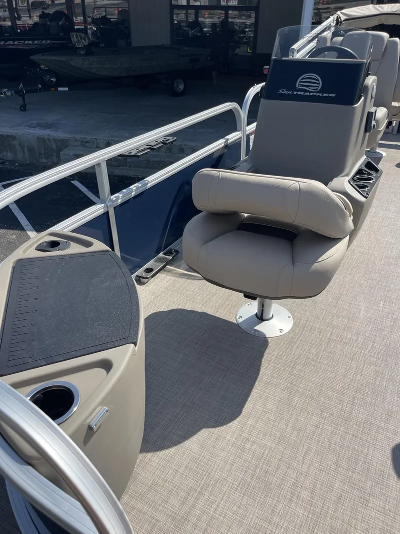Slide: The Image of 2025 Sun Tracker Bass Buggy 18 DLX pontoon boat interior with comfortable seating. - 5