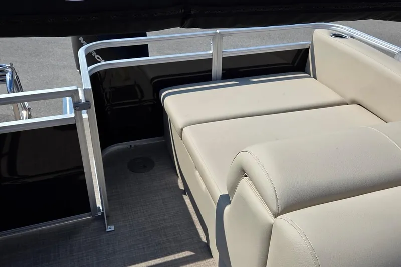 Slide: The Image of 2025 Sun Tracker Sportfish 24 XP3 boat interior with beige seating and sleek design. - 6