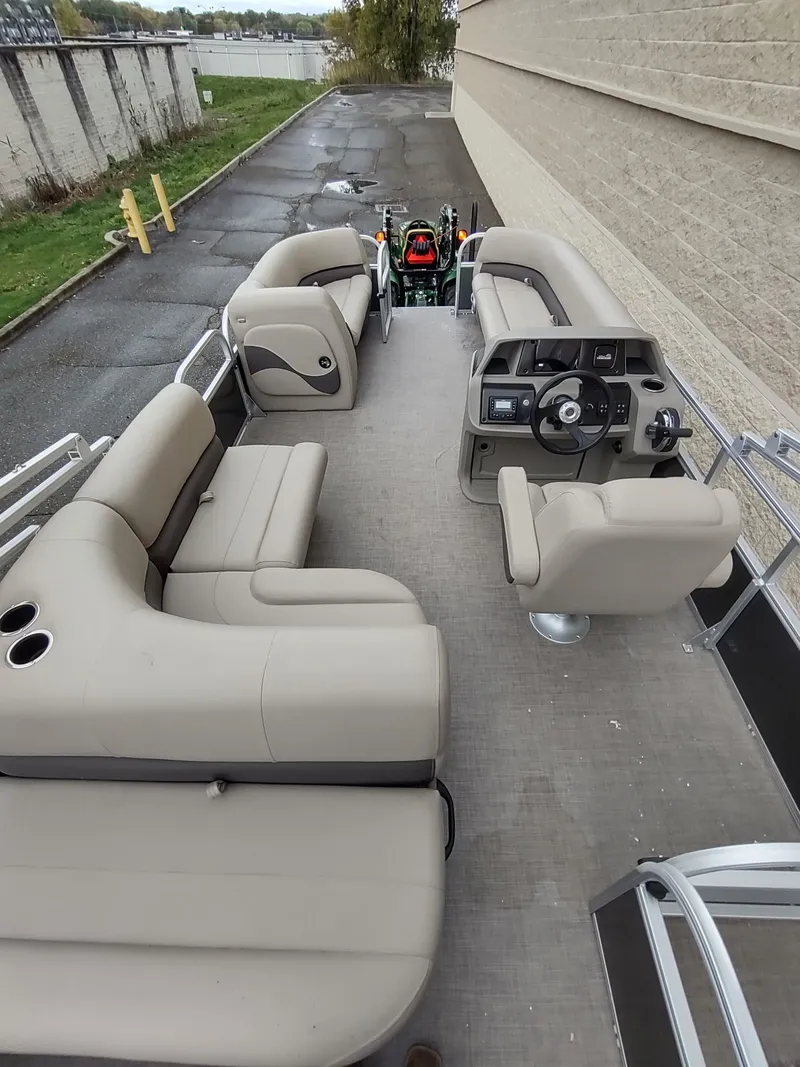 Slide: The Image of 2025 Sun Tracker Party Barge 18 DLX with spacious seating and modern controls. - 5