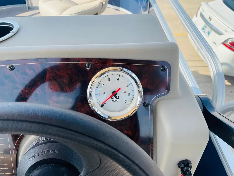 Slide: The Image of RPM gauge on 2025 Sun Tracker Bass Buggy 16 XL Select boat dashboard. - 22
