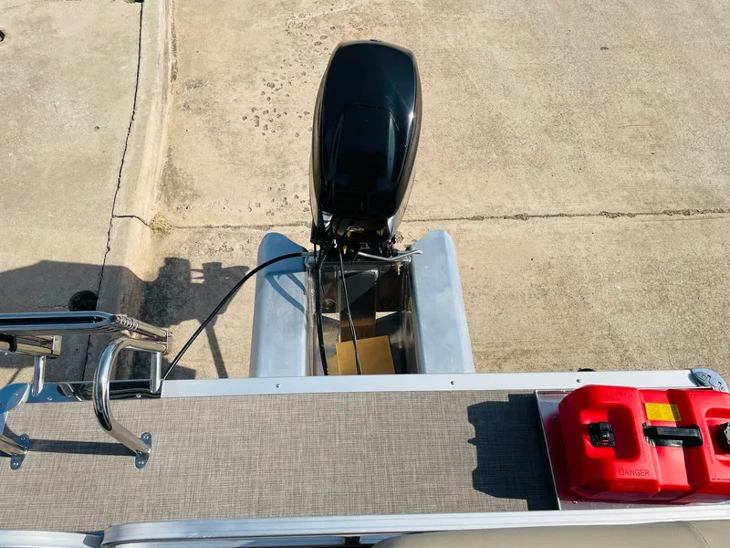 Slide: The Image of 2025 Sun Tracker Bass Buggy 16 XL Select with outboard motor and fuel tanks. - 24