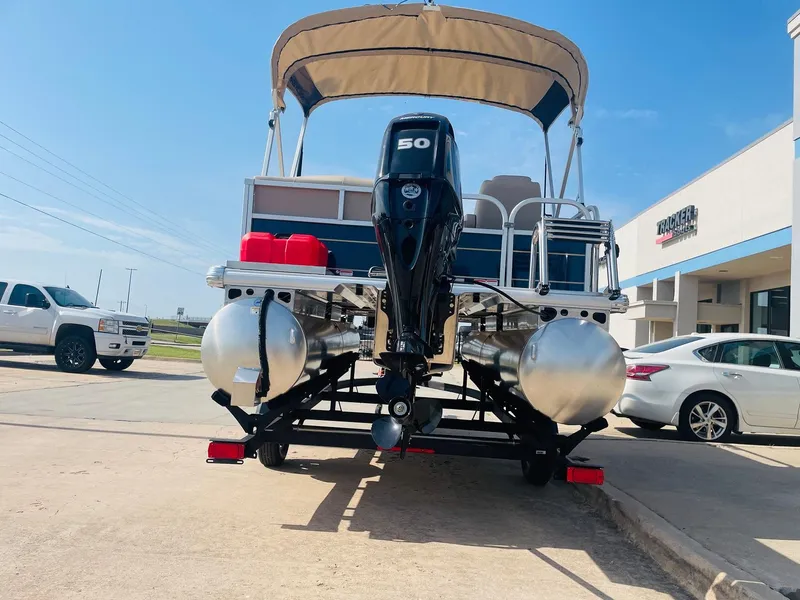 Slide: The Image of 2025 Sun Tracker Bass Buggy 16 XL Select pontoon boat with outboard motor. - 6