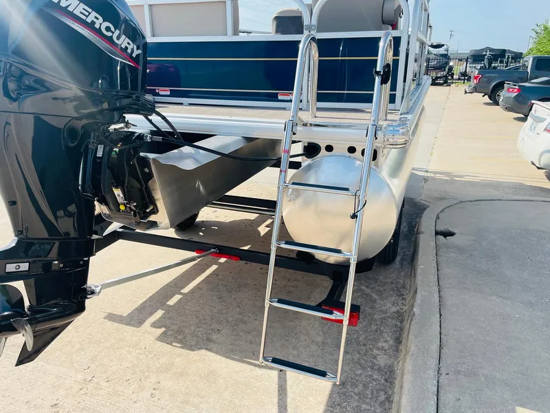 Slide: The Image of 2025 Sun Tracker Bass Buggy 16 XL Select with Mercury engine and boarding ladder. - 7