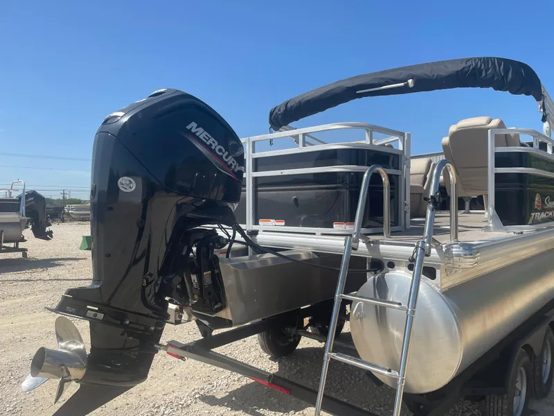 Slide: The Image of 2025 Sun Tracker SportFish 20 DLX pontoon boat with Mercury outboard motor. - 4