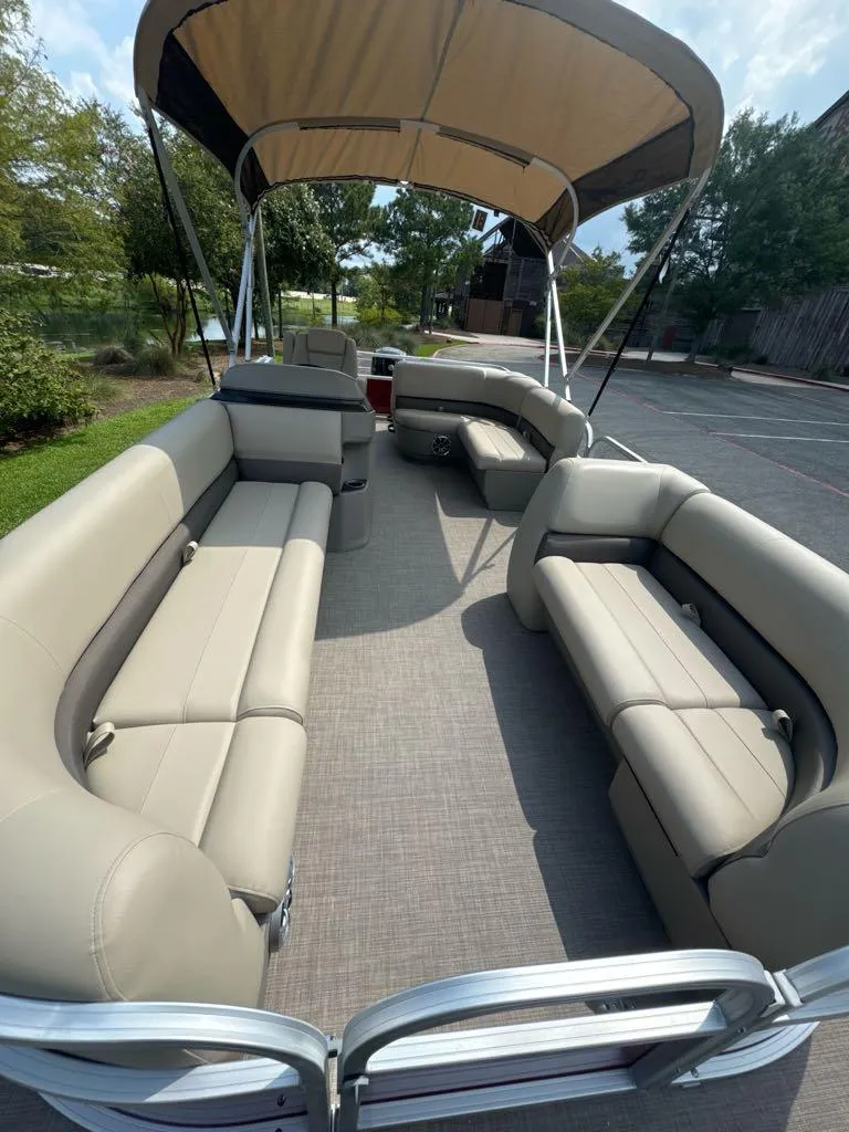 Slide: The Image of 2025 Sun Tracker Party Barge 18 DLX with spacious seating and canopy. - 4