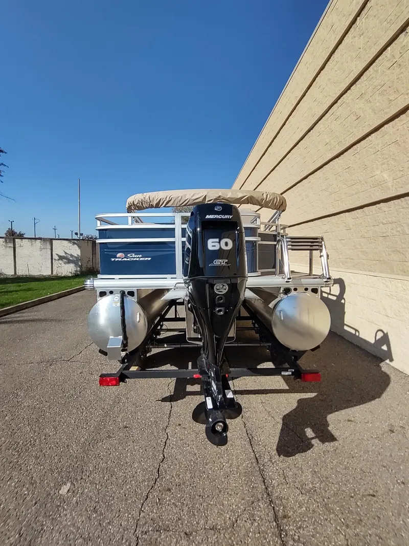Slide: The Image of 2025 Sun Tracker Fishin' Barge 20 DLX pontoon boat with Mercury 60 outboard motor. - 5