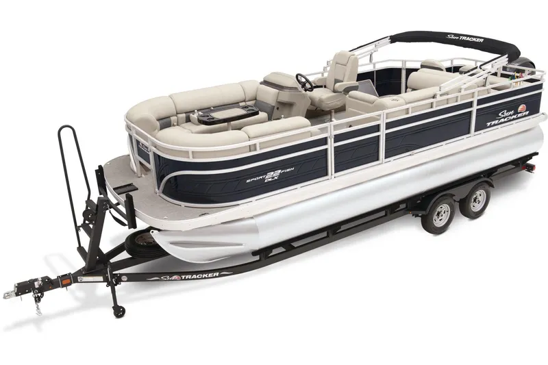 The Image of 2025 Sun Tracker SportFish 22 DLX pontoon boat on trailer, featuring spacious seating and sleek design. - 0