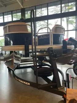 Slide: The Image of 2025 Sun Tracker Party Barge 16 DLX pontoon boat on display indoors. - 46