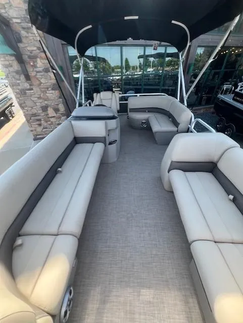 Slide: The Image of 2025 Sun Tracker Party Barge 18 DLX interior with spacious seating and canopy. - 3