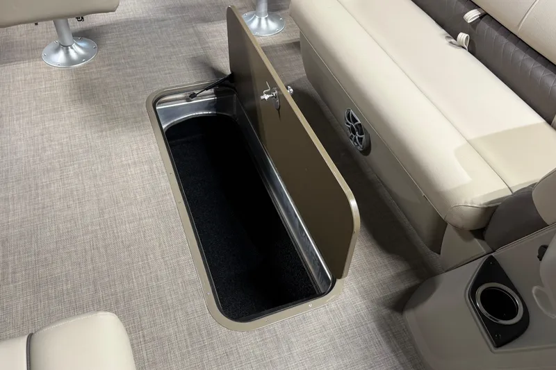 Slide: The Image of 2025 Sun Tracker Sportfish 24 XP3 boat interior with open storage compartment. - 23