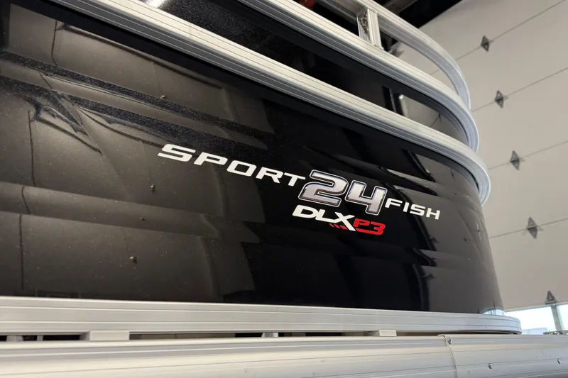 Slide: The Image of 2025 Sun Tracker Sportfish 24 XP3 boat, black exterior with model branding. - 28