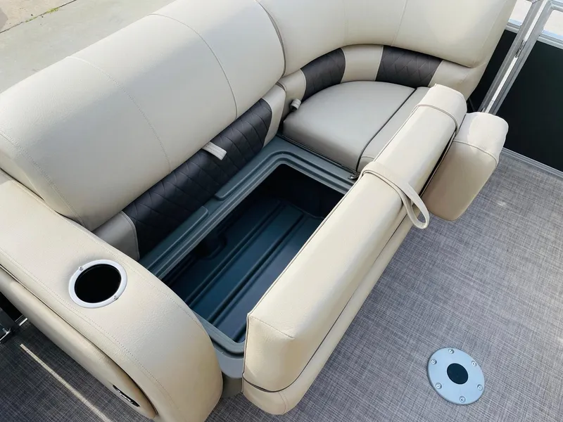 Slide: The Image of 2025 Sun Tracker Party Barge 22 RF DLX seating with storage compartment and cup holder. - 13