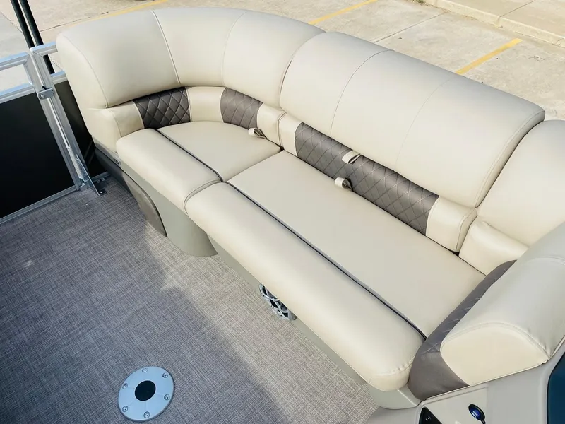 Slide: The Image of 2025 Sun Tracker Party Barge 22 RF DLX, beige seating, quilted accents, spacious layout. - 15