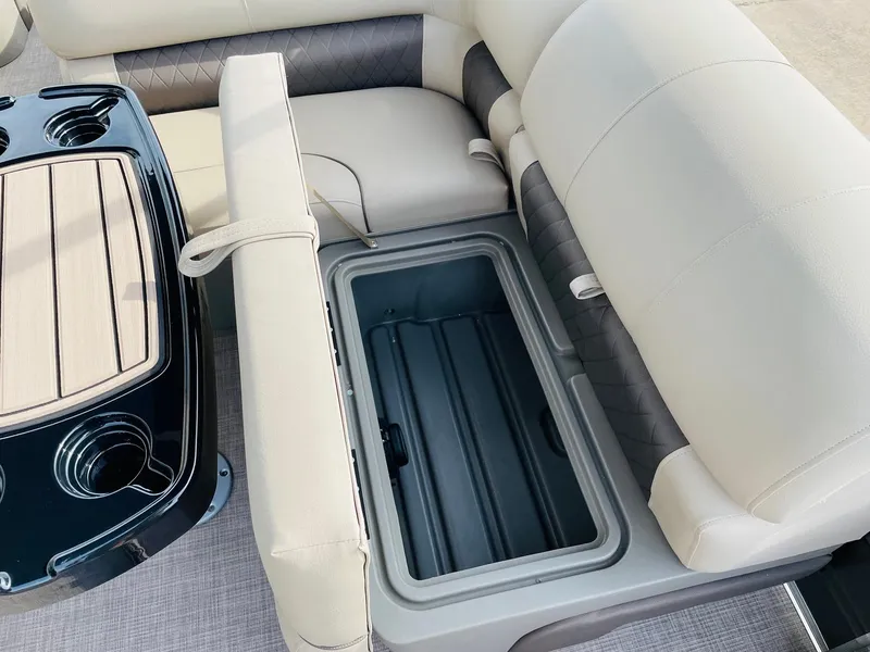 Slide: The Image of 2025 Sun Tracker Party Barge 22 RF DLX seating with built-in storage compartment. - 23