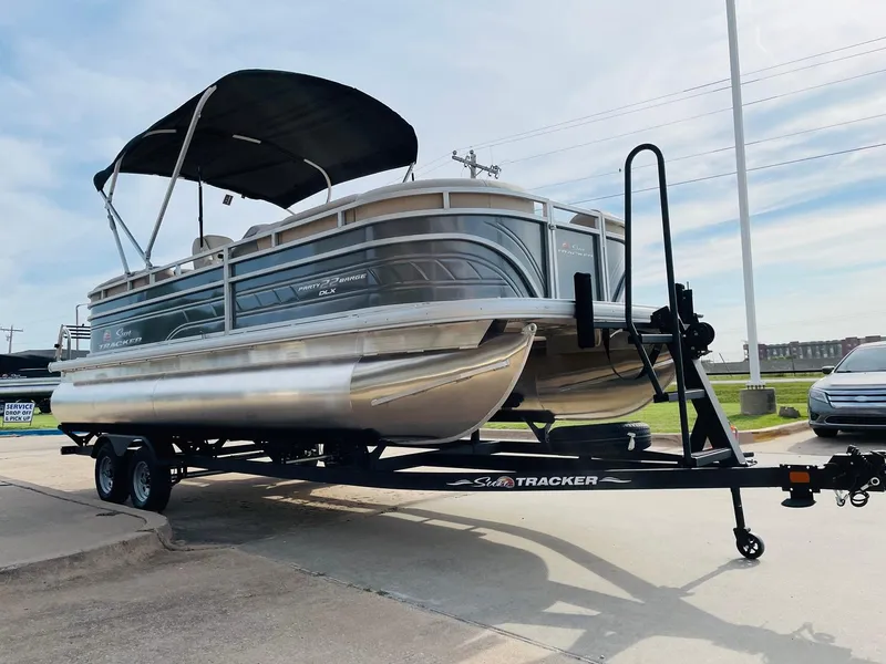 Slide: The Image of 2025 Sun Tracker Party Barge 22 RF DLX pontoon boat on trailer. - 3