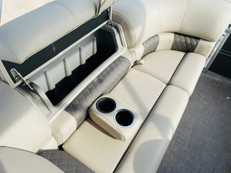 Slide: The Image of 2025 Sun Tracker Party Barge 22 RF DLX seating with storage and cup holders. - 30