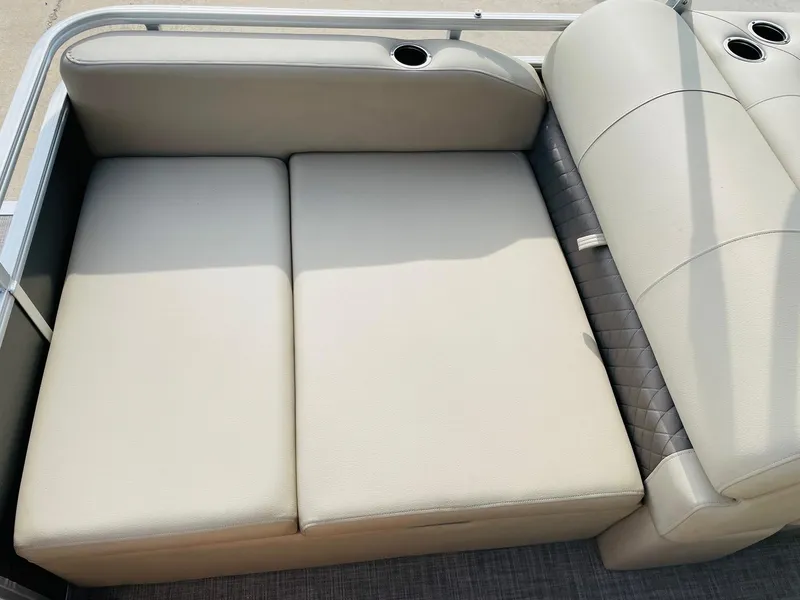 Slide: The Image of 2025 Sun Tracker Party Barge 22 RF DLX boat seating with cup holders. - 34