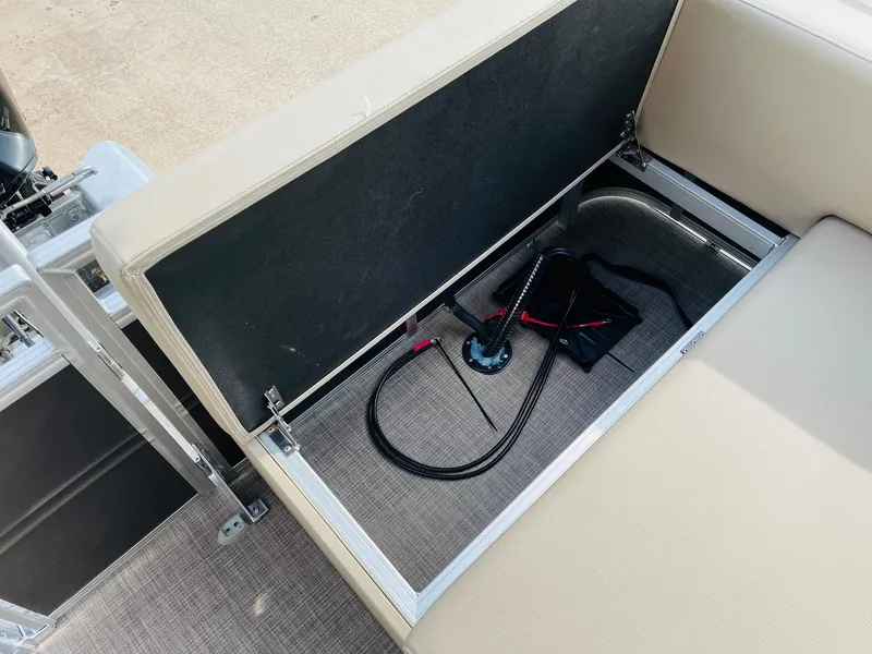 Slide: The Image of Storage compartment in 2025 Sun Tracker Party Barge 22 RF DLX with pump and cables. - 38